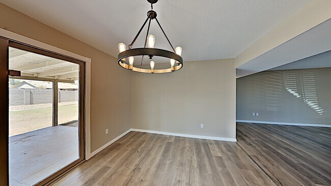 Dining room with newly installed chandelier - 130 E Harvard Dr