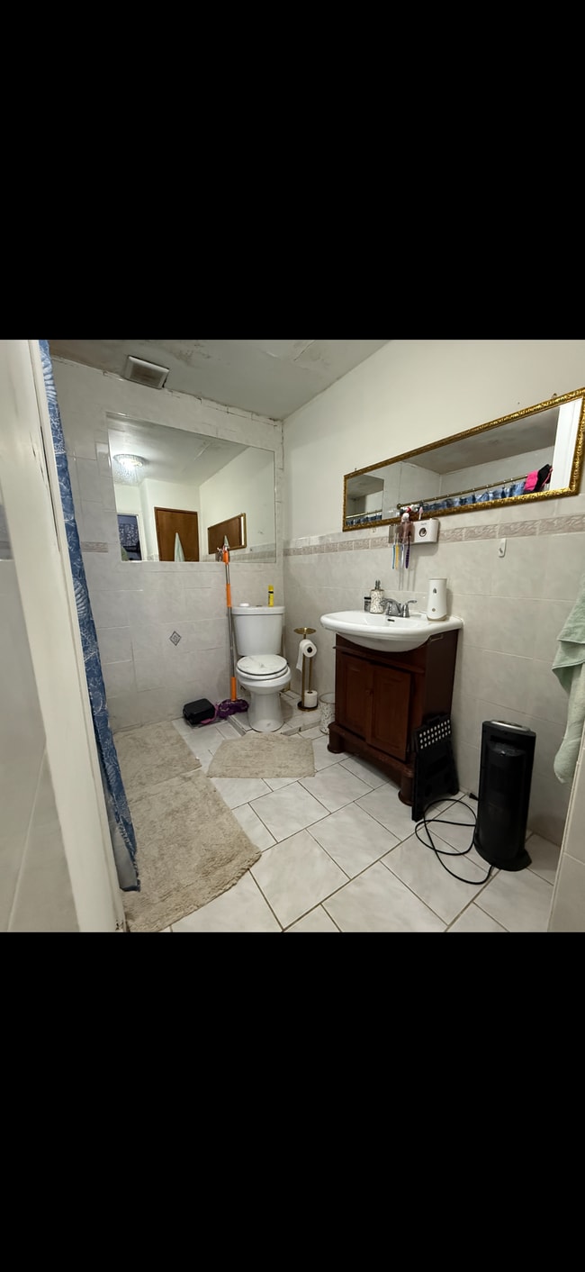 bathroom with standing shower - 13427 135th Ave