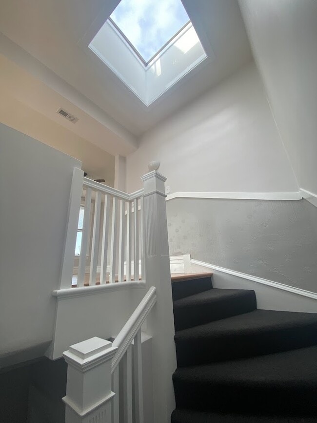 stairwell entry with skylight - 4200 N Damen Ave