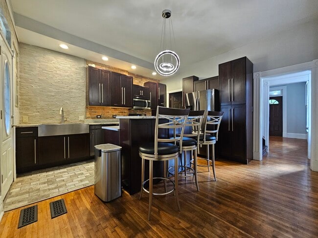 Original wooden floors throughout the whole townhome - 943 Highland St