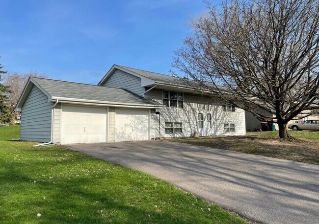 Exterior - Duplex (Unit on right hand side) with use of garage (one stall - right hand side) include - 4995 Tyler St NE