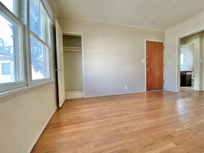 Living room with closet door open - 719 S Chapel Ave