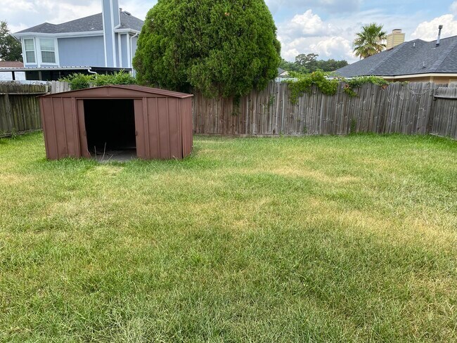 Spacious backyard with Shed - 6319 Foxhunter Rd