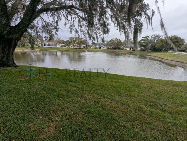 Building Photo - Adorable 55+ 2/2 on lakefront lot with NEW...