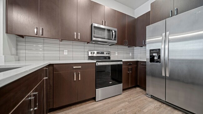 Cocina de casa modelo - The Summit Lofts
