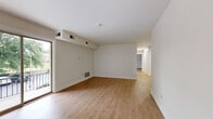 Located at 440 Euclid Ave in Lancaster, PA, this single-floor, 2-bedroom, 2-bathroom residence offers a well-organized layout with consistent, modern finishes throughout. Light wood-tone laminate flooring runs continuously across all rooms, creating a cohesive and clean aesthetic.

The living room is a generously proportioned space anchored by a full-width sliding glass door that opens to a railed balcony, offering views of mature trees and the surrounding area. Natural light fills the room, complementing the neutral white walls. An adjacent window further brightens the space. The kitchen features stainless steel appliances—including a gas range and full-size refrigerator—paired with light wood cabinetry, white countertops, and recessed lighting.

Both bedrooms are well-sized with clean white walls and natural light. The primary bedroom includes a walk-in closet with built-in shelving rods. Both bathrooms are finished with marble-style tile flooring, light wood vanities with white countertops, brushed nickel fixtures, and mirrored medicine cabinets. The overall ambiance is bright, neutral, and move-in ready, with a practical layout suited for comfortable everyday living.