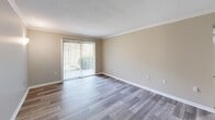 Located at 500 Manor View Dr in Knoxville, Tennessee, this single-floor 1-bedroom, 1-bathroom residence offers a thoughtfully designed layout with modern finishes throughout. Wood-look luxury vinyl flooring flows consistently across all rooms, creating a cohesive and low-maintenance aesthetic.

The living room is bright and open, featuring crown molding, a textured ceiling, and a full sliding glass door with vertical blinds that fills the space with natural light and provides outdoor access. The adjacent dining area connects seamlessly to the kitchen, which is equipped with white shaker-style cabinetry, granite countertops, stainless steel appliances including a refrigerator and dishwasher, and access to an in-unit laundry area.

The spacious primary bedroom includes a ceiling fan with light fixture, a window with blinds for natural light and ventilation, and clean neutral-toned walls with crisp white baseboards. Crown molding adds a refined touch to the living areas.

The bathroom is well-finished, featuring a white vanity with granite countertop and framed mirror, a tub-shower combination with tile surround, and coordinating wood-look flooring. A hallway connects the main living areas to the private spaces, completing the efficient and functional floor plan.