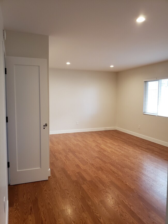 2nd Living room area to the right of entry door with storage closet - 1911 Grant Ave