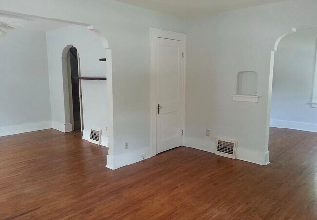 Living room (dining room and office/flex space seen through doorways) - 100 Highland Dr