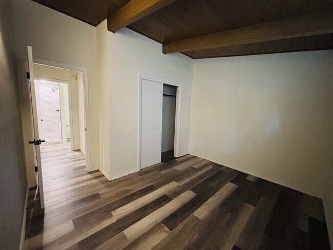 Building Photo - Quirky Mid-Century 3BR with High Beam Ceilings + Fenced Yard – $1,500