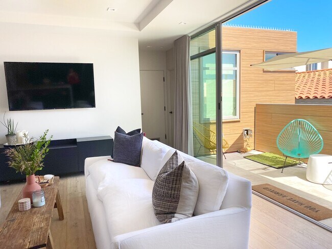 Open Living Room with Sliding Doors - 2312 The Strand