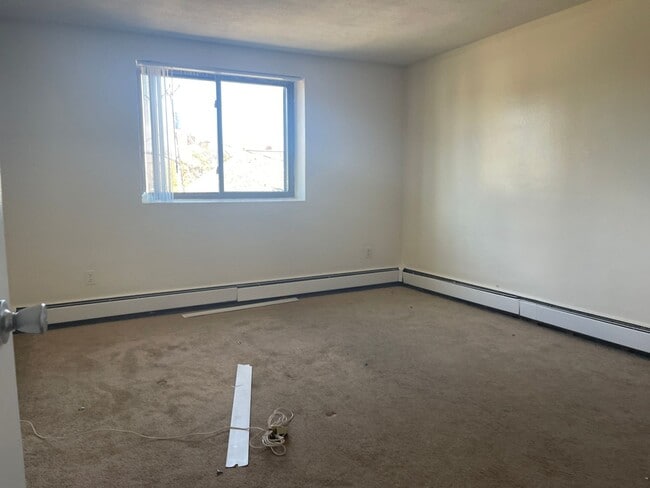 Building Photo - No Fee Massive 2 bed with New floors, kitchen and paint, AC VERY SUNNY!!  PARKING INCLUDED