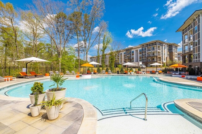 Salt-Water Pool - Resort-style pool with sun shelf, cabanas and grills for relaxing and entertaining close to home. - Linz Holly Springs