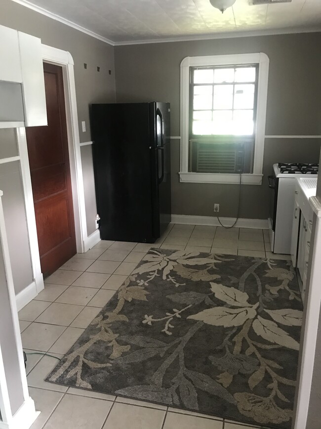 Kitchen pictured from the dining room/makeshift second bedroom - 704 Avenue G