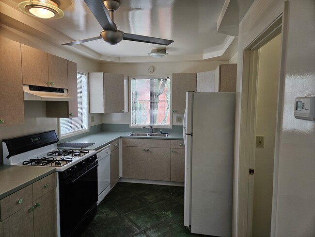 Kitchen view and entry to laundry and bathroom areas - 3495 Redwood Ave