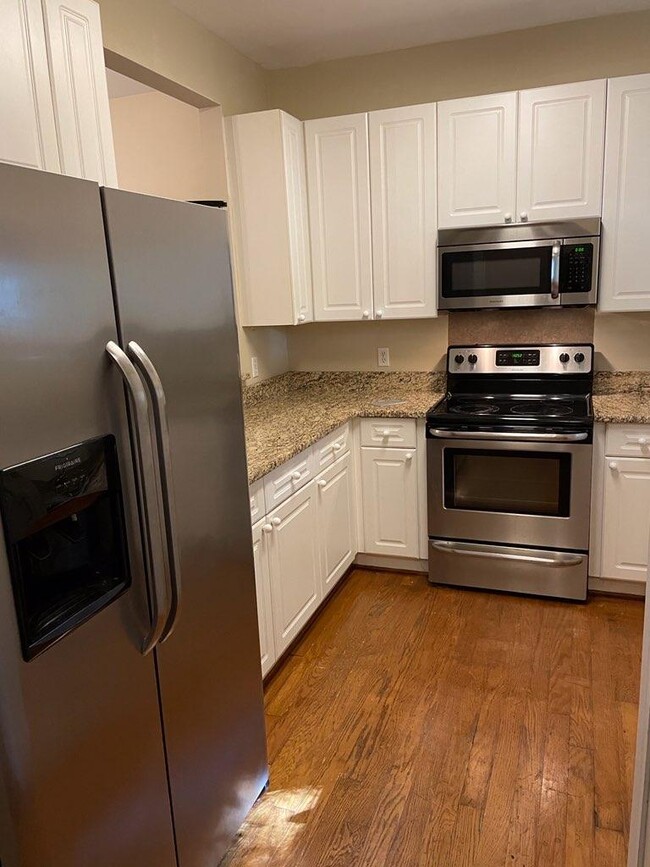 The newly Refinished Hardwood Floors in the Kitchen and downstairs - 314 S Cedar St
