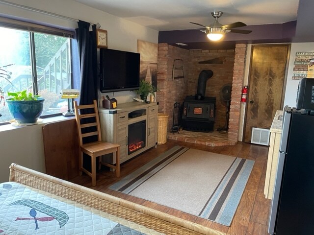 Smart TV, DVD play, electric fireplace and wood burning stove. - 3239 Long Lake Dr SE
