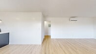 Located at 1313 Huntington Dr in the desirable community of South Pasadena, CA, this well-designed 2-bedroom, 1-bathroom residence offers a clean, modern aesthetic across a single floor. Light wood laminate flooring flows seamlessly throughout the space, complementing the bright white walls and creating a warm, cohesive feel.

The kitchen is a standout feature, showcasing dark navy cabinetry with gold hardware, white countertops, open wood floating shelves, stainless steel appliances including a range with overhead hood, dishwasher, and refrigerator, plus a deep utility sink — a stylish and functional galley-style layout.

The primary bedroom is a generous size and includes wall-mounted mini-split air conditioning, a large sliding-door closet, and a connected hallway with built-in shelving. The second bedroom benefits from wide windows with views of surrounding greenery, providing excellent natural light and a connection to the outdoors. Both bedrooms feature individual mini-split climate control units for personalized comfort.

The bathroom is finished with modern detail, including hexagonal tile flooring, white subway-tiled tub-shower combo, a wood-toned vanity with white countertop, and matte black fixtures and hardware. A hallway connects the living areas, completing this thoughtfully updated residence.