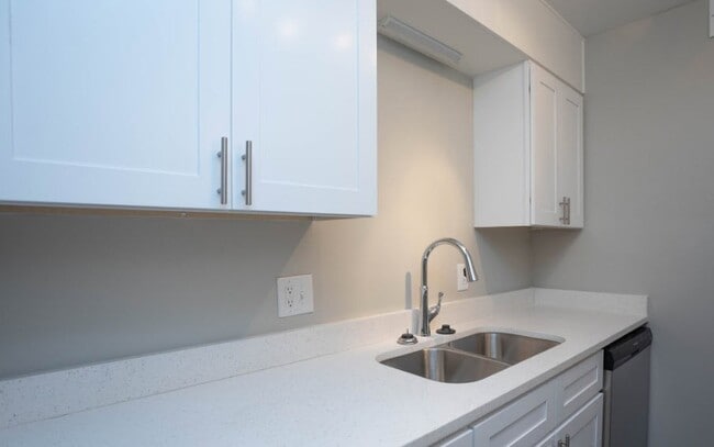 Elevate your lifestyle at Richmond Hills Apartments, where modern kitchens feature sleek white cabinetry and elegant countertops. Enjoy a space designed for comfort and style. Schedule a tour today and see your future home! - Richmond Hills Apartments