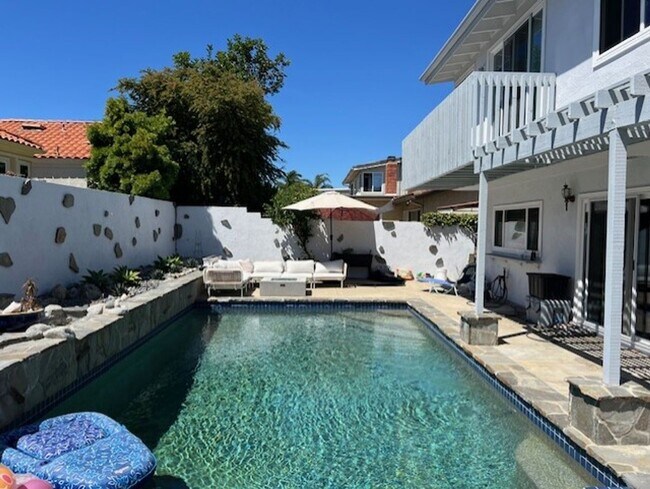 Building Photo - Coastal Elegance Meets Family Comfort in D...