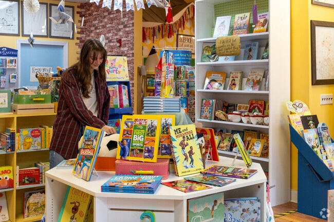 A customer browses the books at Little Shop of Stories in Downtown Decatur.