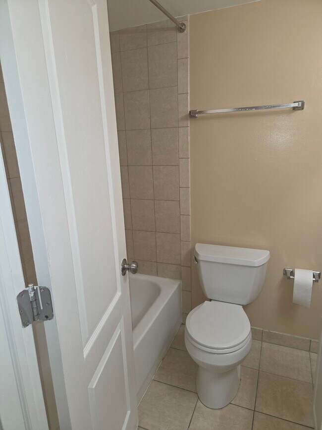 Bathroom with wood vanity cabinet - 6300 Hil Mar Dr