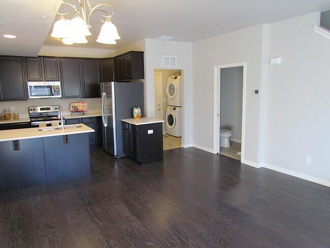 Wood floors on main level, washer/dryer in entryway to attached 2-car garage. - 3800 Manhattan Ave
