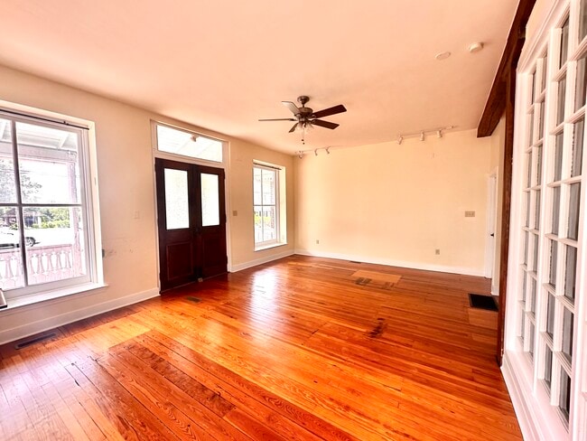 Living room looking toward front porch - 1301 W Strasburg Rd