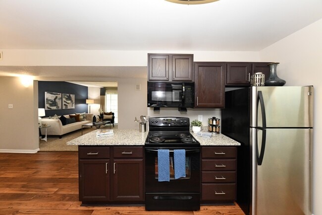 Kitchen with granite counters and modern cabinetry - Branchwater