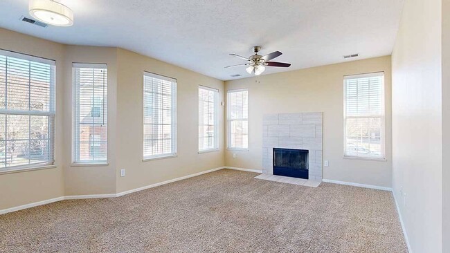 Our 3-bedroom Milan has a spacious living room that features ample natural light. - Ridge Pointe Villas