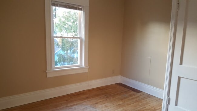 Upper bedroom w wood floor - 404 W Court St
