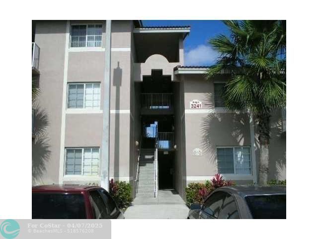 Building Photo - 3241 Sabal Palm Manor