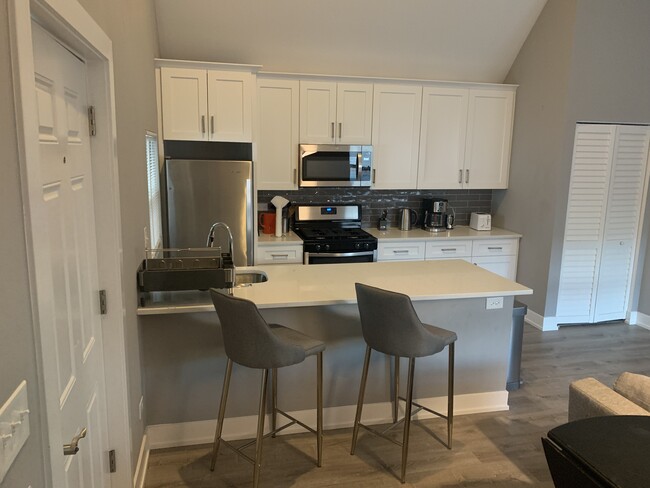 Open kitchen with island, all new appliances and dishwasher - 2019 N Sawyer Ave