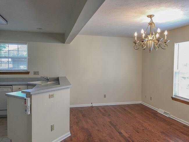 Hardwood floors and chandelier lighting in the dining room - 1008 Middletown Rd