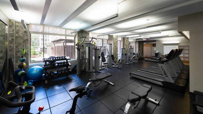 photo of Chelsea Centro Gym in daytime with windows, athletic flooring, workout machine equipment, and televisions - Chelsea Centro