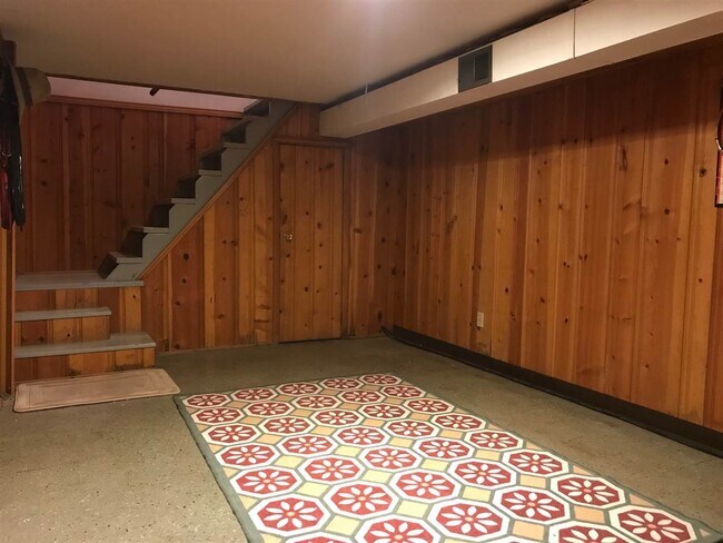Basement rec room - door under stairs leads to workshop - 151 S Bonnie Brae St