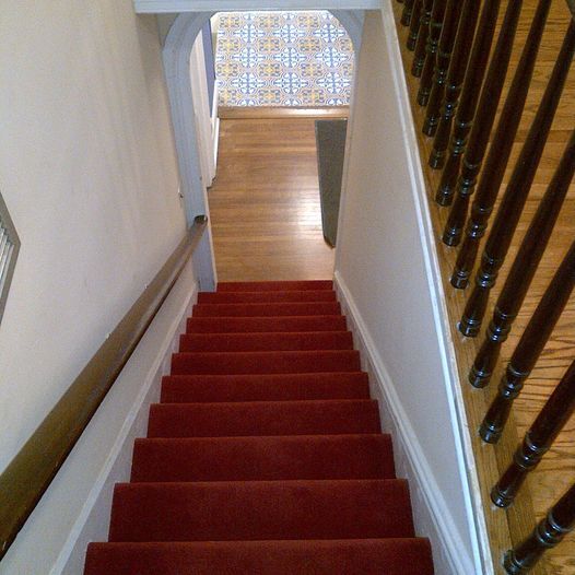 Carpeted Staircase to apartment - 168 Main St