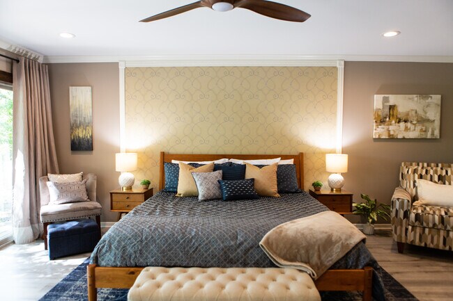 Master bedroom with ceiling fan, dimmer lights and blackout curtains. - 967 Greenwood Ln