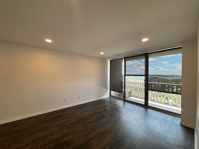 Living room with updated dimmable LED lighting. - 1502 S Boulder Ave