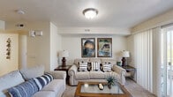 Located in West Jordan, Utah, this well-appointed 2-bedroom, 2-bathroom single-floor home offers a practical and comfortable layout. The open kitchen is a standout feature, highlighted by a skylight that floods the space with natural light. Warm oak cabinetry, a breakfast bar peninsula, hardwood-style flooring, and white appliances including a dishwasher, range, microwave, and refrigerator make it both functional and inviting. A dining area sits adjacent to the kitchen, perfect for everyday meals.

The living room is generously sized with plush carpet, neutral walls, and a sliding glass door that opens to a patio, allowing for natural light and outdoor access. The primary bedroom offers comfortable proportions, carpet flooring, and a large walk-in closet fitted with wire shelving for ample storage. The en-suite bathroom features tile flooring, a soaking tub with shower, built-in open shelving, and a single-sink vanity. The second bedroom is cozy and well-lit, with a window and carpet flooring. The second full bathroom also includes tile flooring, a tub-shower combo, built-in shelving, and a vanity. A utility room and hallway round out the thoughtfully organized floor plan.