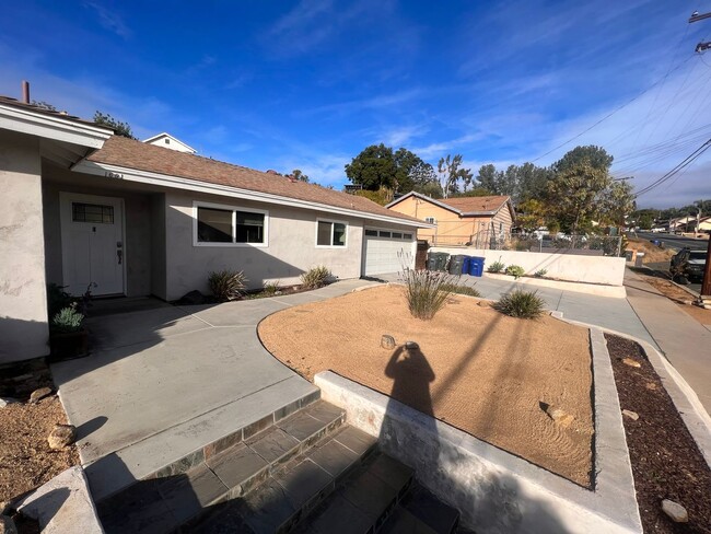 Building Photo - UPDATED 4br/2ba HOME w/ attached GARAGE in...