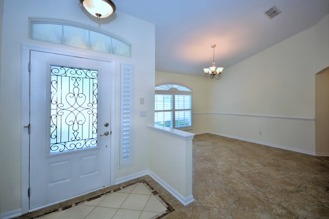 Front entrance with dining area - 4538 Palmetto Cove Ln
