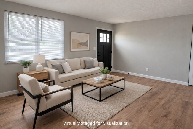 Sala de estar virtualmente decorada para visualización. - 5363 Burgundy Pl