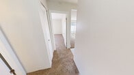 Located at 357 Brittany Farms Rd in New Britain, CT, this one-bedroom, one-bathroom unit offers a functional and well-organized single-floor layout. The kitchen is a standout feature, equipped with stainless steel appliances including a gas range, built-in microwave, and dishwasher, complemented by white cabinetry, dark granite-style countertops, and light tile flooring. An elegant chandelier illuminates the adjacent dining area, adding a touch of character to the space. The spacious bedroom features plush carpeting, a generous closet with louvered doors, and a window that invites natural light, creating a bright and comfortable retreat. A baseboard heating system is present throughout the unit, ensuring warmth during Connecticut's cooler seasons. The full bathroom is clean and well-appointed, featuring tile flooring, a white vanity with ample counter space, a mirrored medicine cabinet, and a full tub-shower combination with brushed nickel fixtures. A carpeted hallway connects the rooms seamlessly, contributing to the unit's cohesive and practical layout. The neutral color palette of soft whites and beiges throughout creates a calm, move-in-ready ambiance suitable for a variety of décor styles.