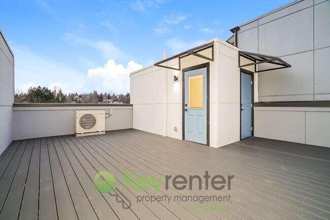 Building Photo - Rooftop Living with Open Concept Design and Parking Included