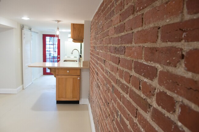 exposed brick wall - 630 Otis Pl NW
