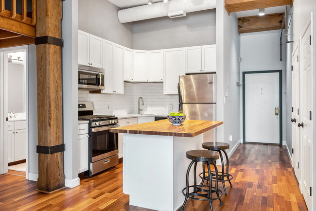Kitchen includes Refrigerator, Gas Range Stove, Microwave and Trash Compactor - 51 W Blenkner St
