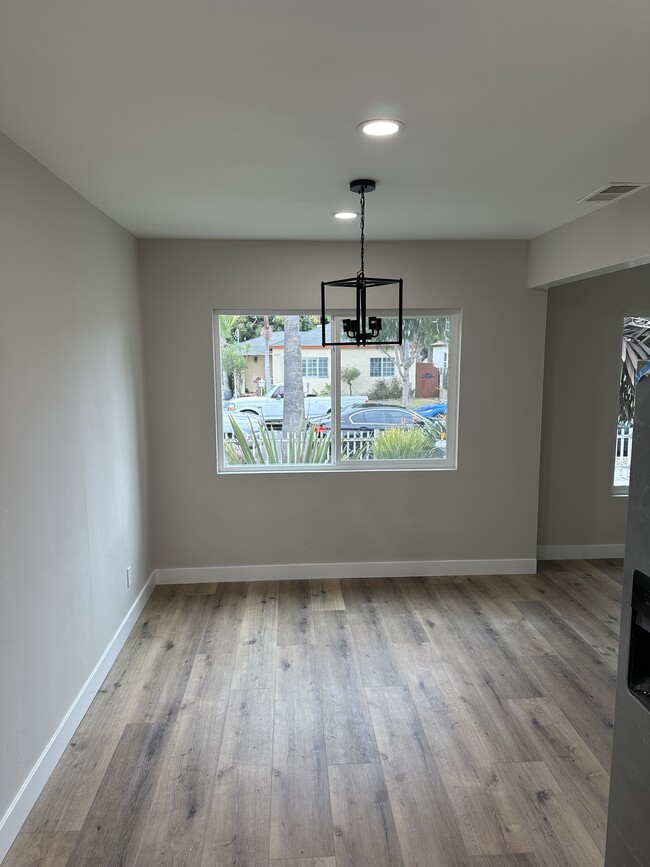 Open concept dining area off kitchen with chandelier - 4230 W 169th St