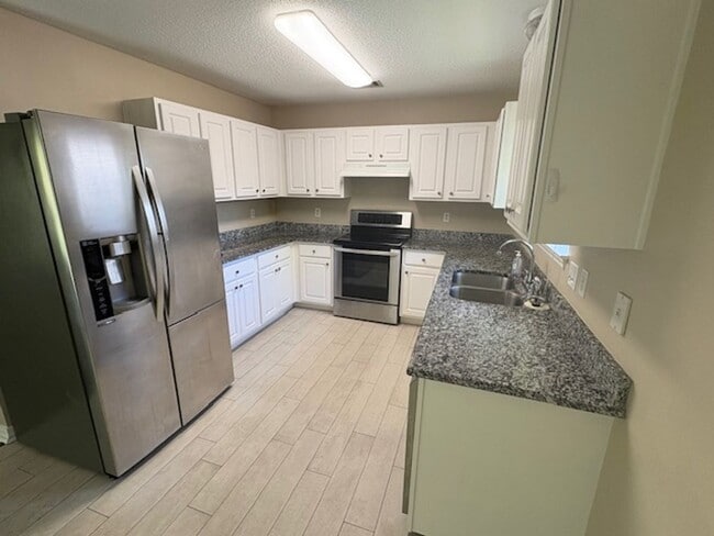 Building Photo - Indian Woods Home with a Cozy Fireplace & Stainless Steel Appliances!