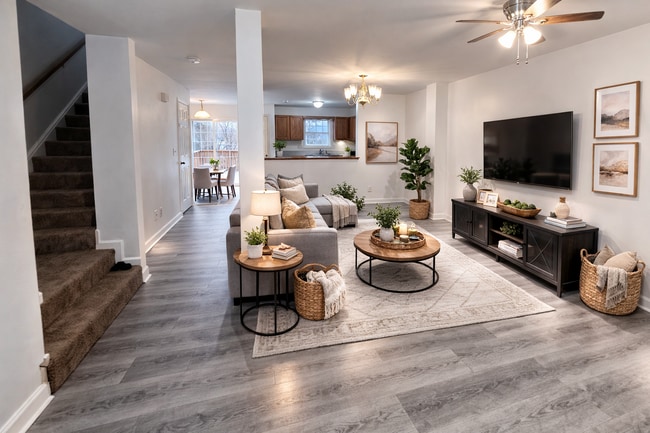 Spacious living room with updated flooring - 7 Lotus Dr